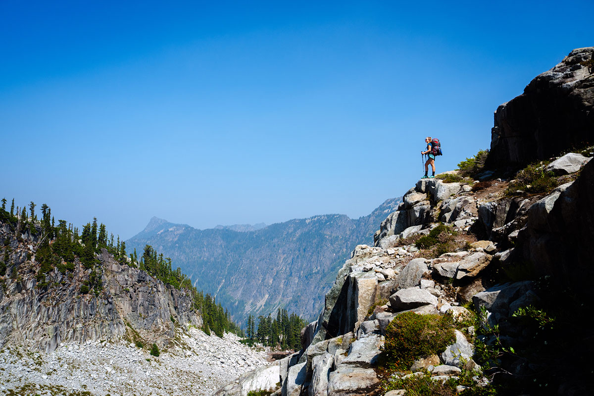 ​​Topo Athletic Ultraventure 3 (wide shot on rocky outcropping)